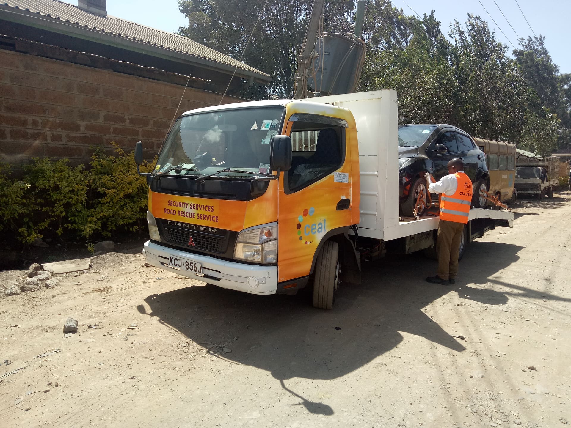 CEAL tow truck operator loading vehicle